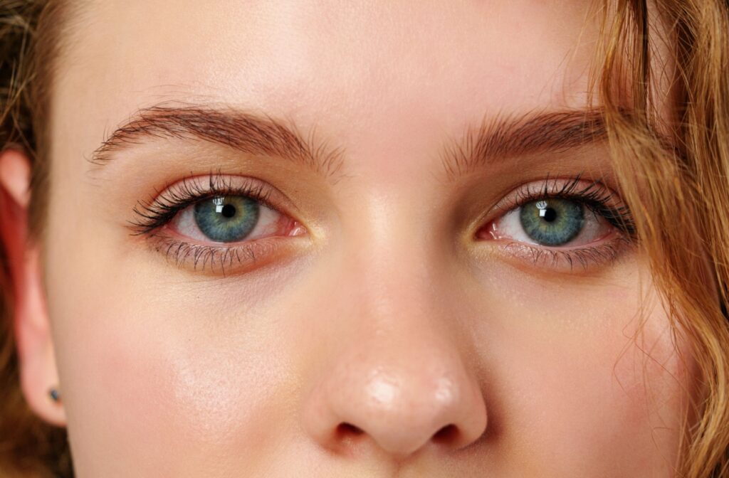 Close up of a beautiful red-headed woman's blue eyes.