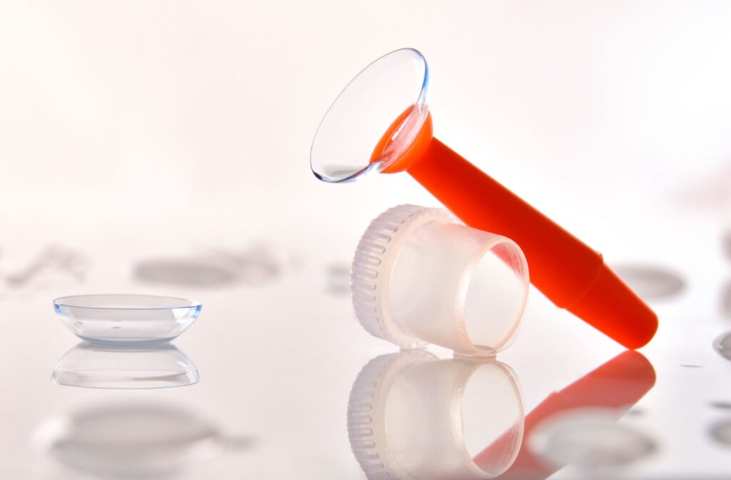 An image of a scleral lens on an orange applicator.