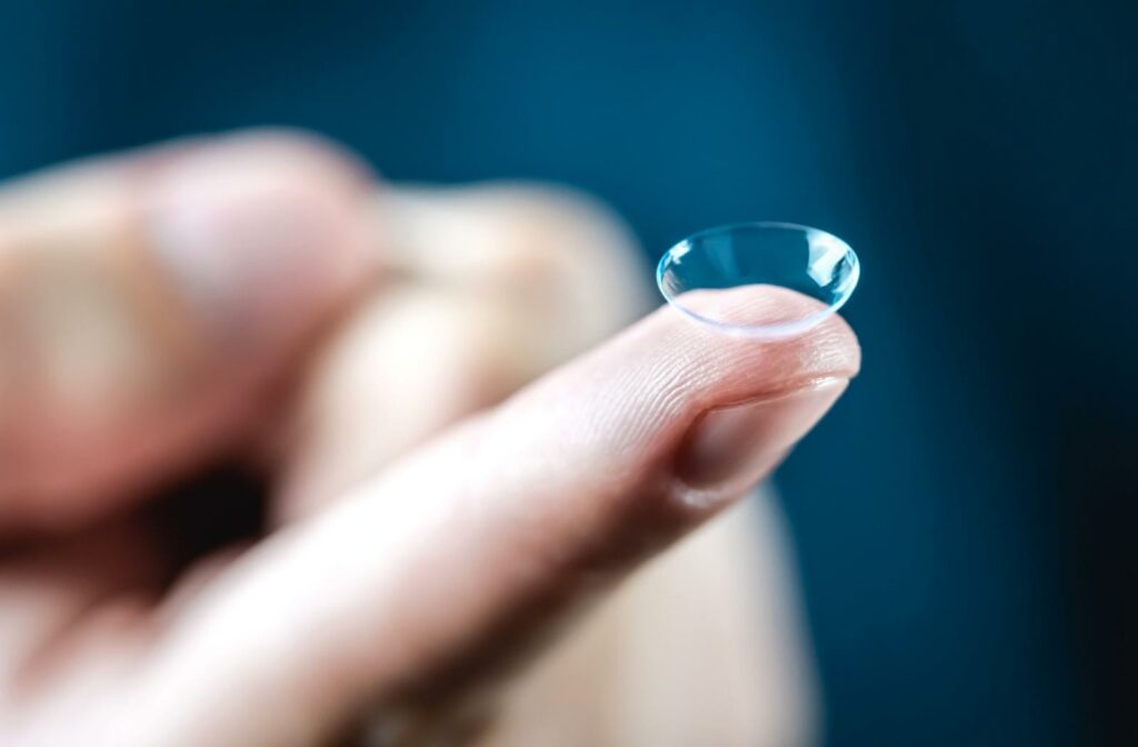 a contact lens resting on a persons finger